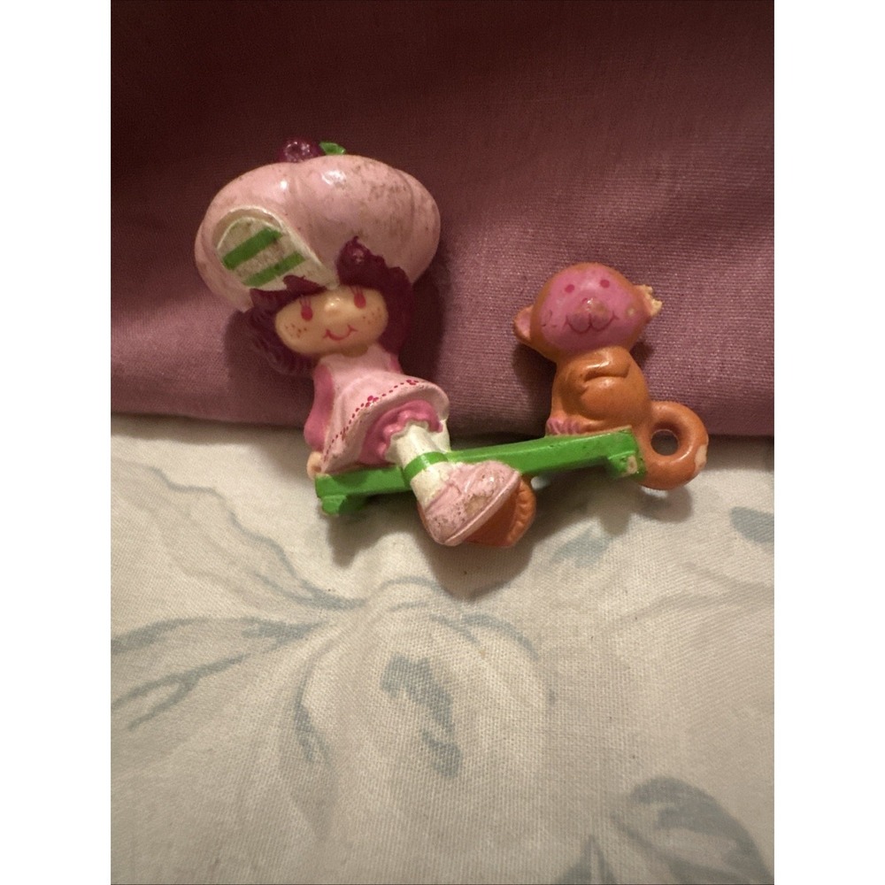 Raspberry Tart on seesaw with her pet monkey, Rhubarb. Strawberry Shortcake